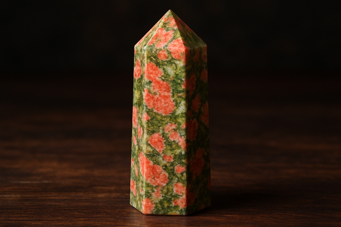 A beautiful unakite crystal tower with a mottled pattern of salmon pink feldspar, forest green epidote, and white quartz creating a natural mosaic