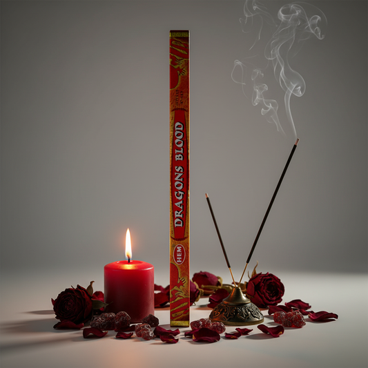 Hem Dragon's Blood incense tube box standing upright with red rose petals and candle props