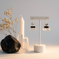 Black Tourmaline and Crystal Quartz raw dangle earrings with sterling silver crescent moon on light grey background