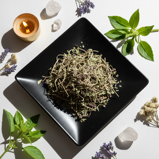 Tulsi Holy Basil dried herbs on black ceramic plate with basil sprigs and crystals