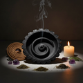 Black ceramic rope incense burner hero shot with crystals and candlelight