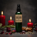 Wicked Witch Mojo Come Hither green spray bottle with red roses, garnet chips and cinnamon props