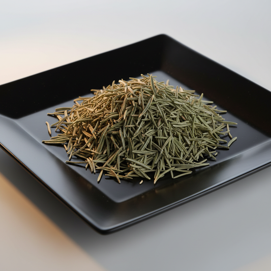 Dried rosemary leaf on black ceramic plate hero shot