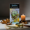 Spiders of Tennessee waterproof field guide pamphlet standing upright with nature props
