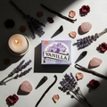 Flat lay of HEM Vanilla Incense Cones box with cones, dried lavender, vanilla pods, rose quartz and candle