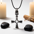 Dragon Hammer solid pewter pendant on black cord, bright white background with candlelight