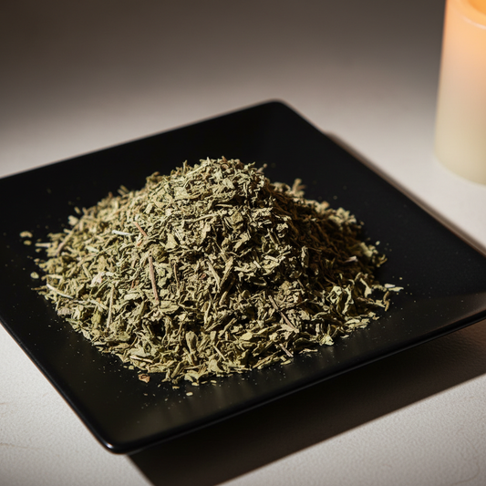 Dried wormwood herb on black ceramic plate hero shot