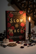 Slow Magic book by Anthony Rella hero shot with red roses, pentacle and candlelight