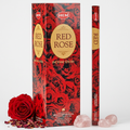 Original HEM Red Rose photo styled with light grey background and rose-themed props